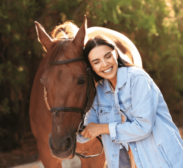 Client Services 1 woman embracing a horse